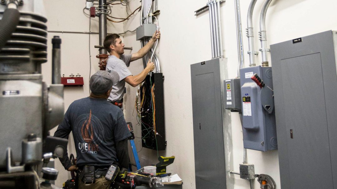 Colonial electric technicians working on an commercial electrical panel upgrade